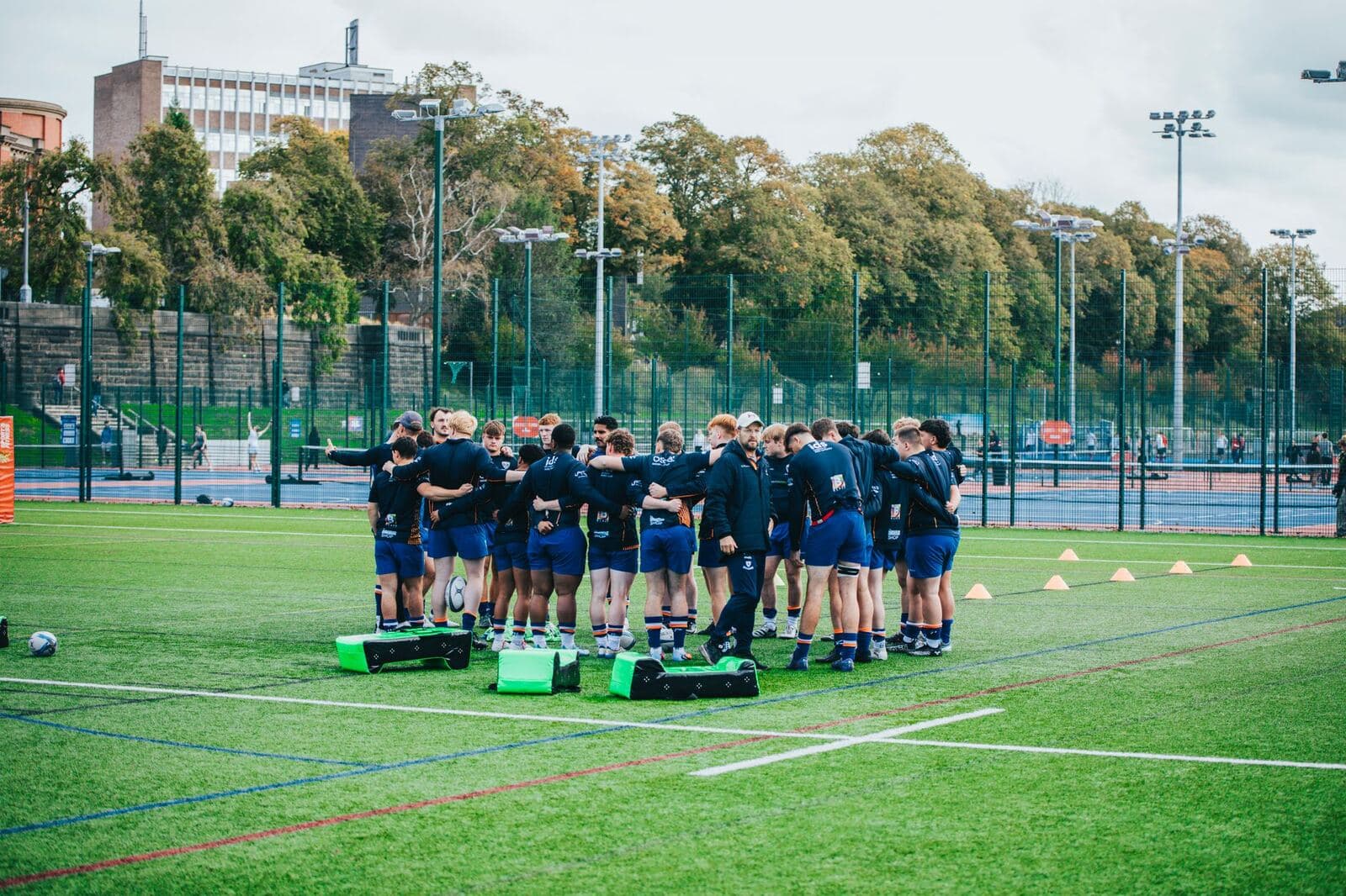 Rugby union players running drills at training