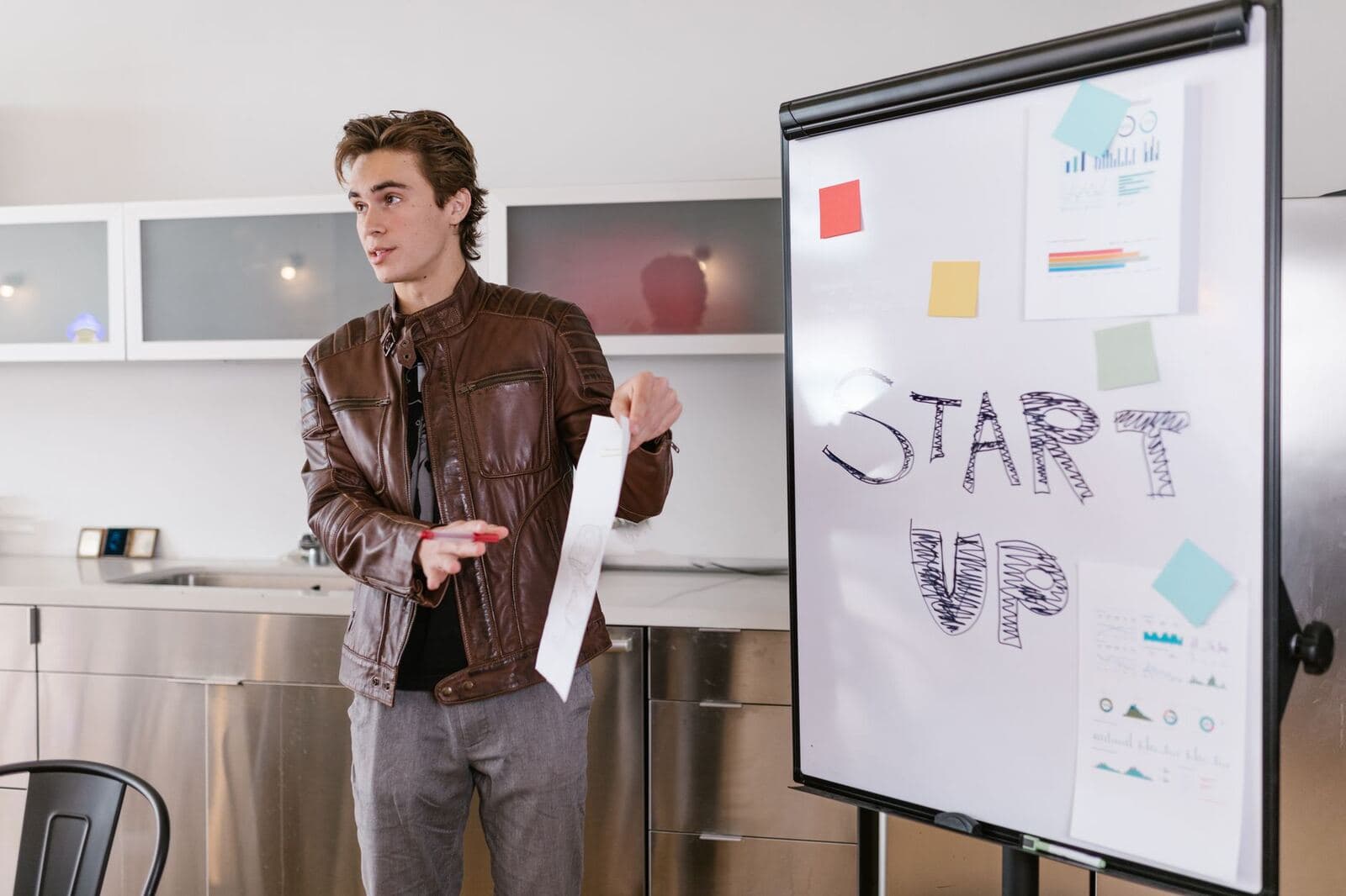 Entrepreneur presenting startup strategy to a small audience